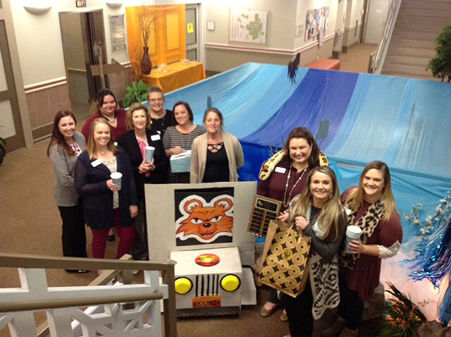 Financial Aid/Scholarship Office group photo with decorations