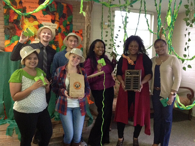 Equity & Inclusion Title IX and Student Money Management Center group photo with decorations