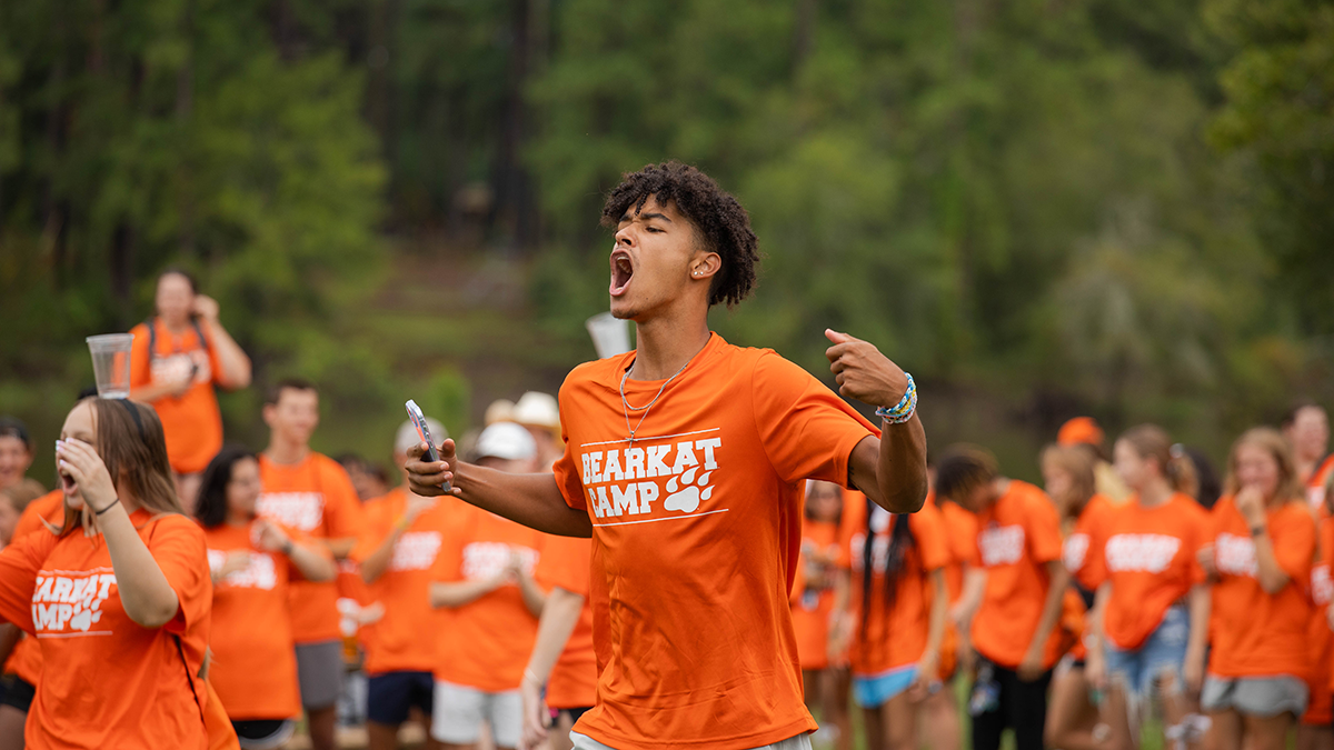 A student cheers excitedly after a game at Bearkat Camp.