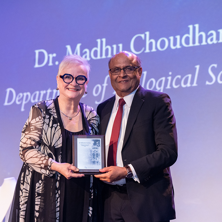 Madhusudan Choudary with University President Alisa White.
