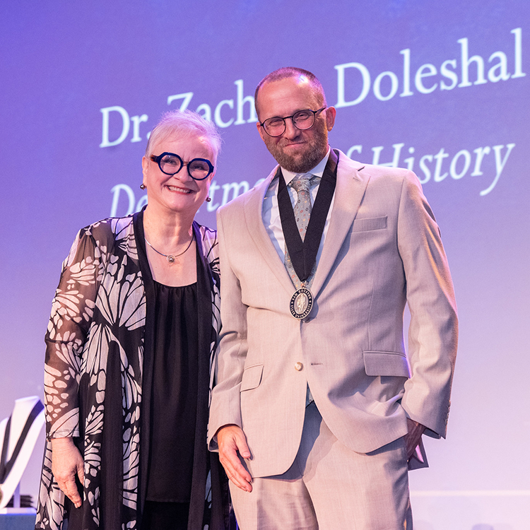 Zachary Doleshal with University President Alisa White.