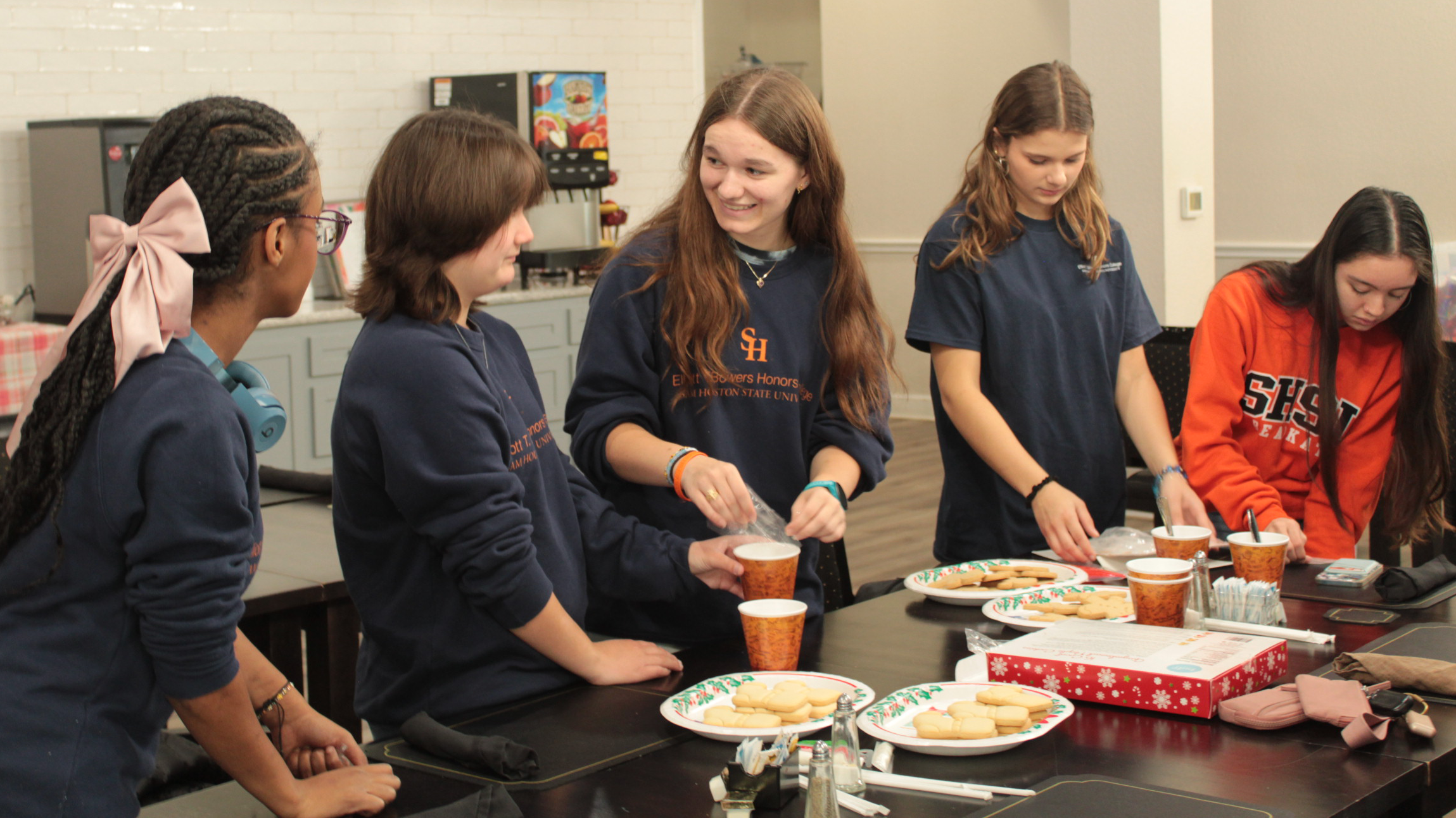 Students from the Elliott T. Bower's Honors College prepare snacks for residents of the Sundale Senior Living Facility.