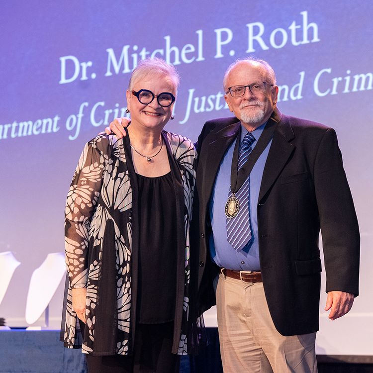 Mitchel Roth with University President Alisa White