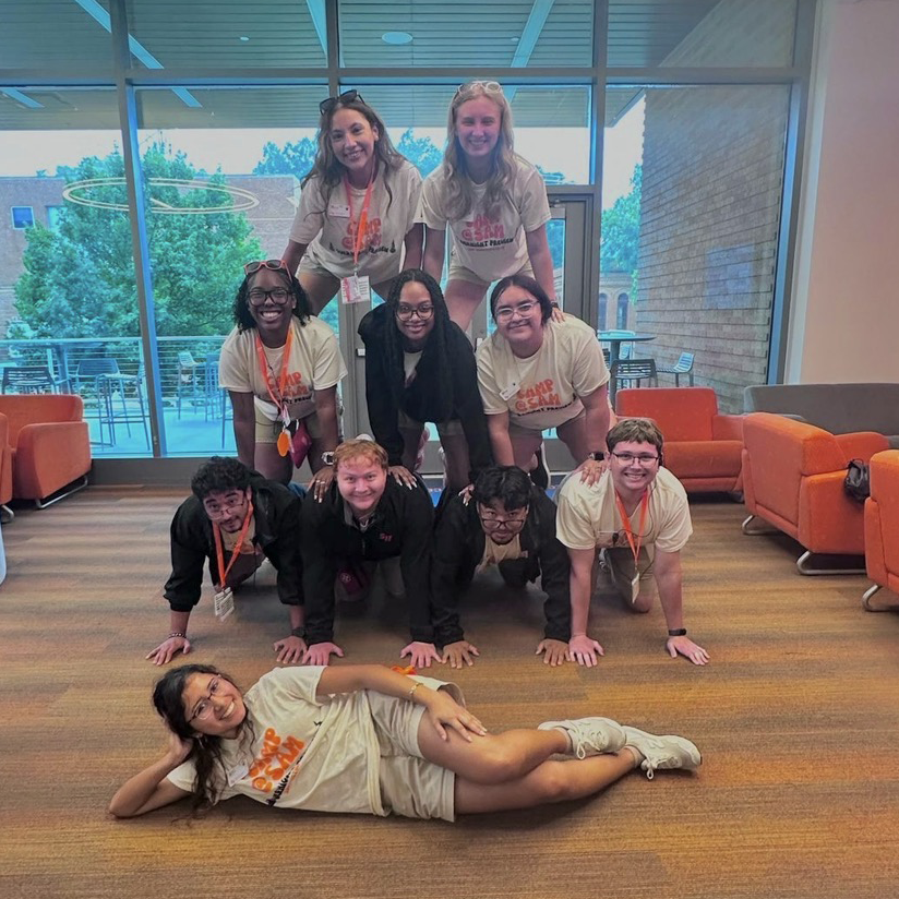 SAMbassadors do a human pyramid.
