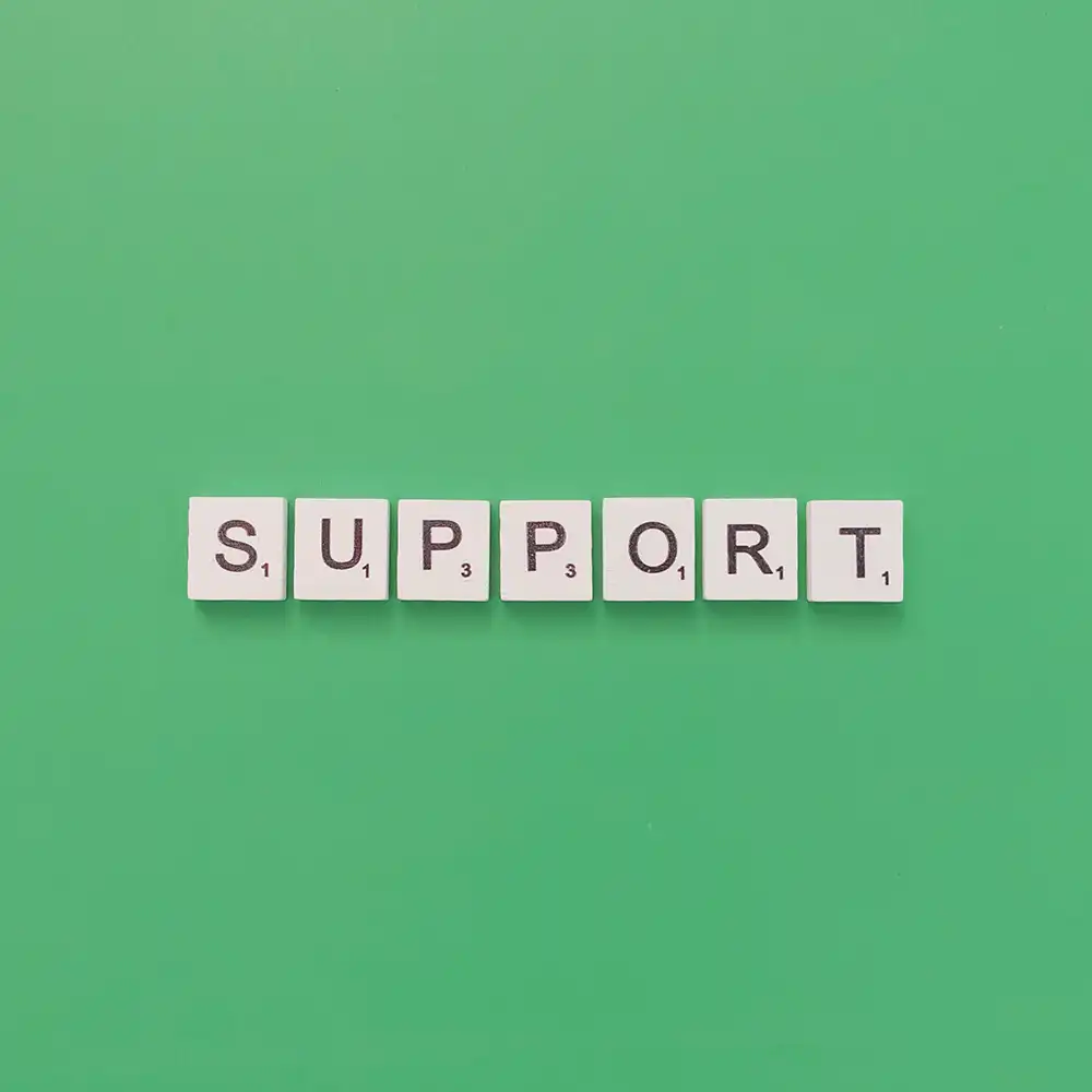 Scrabble tiles that are lined up to spell out “support”