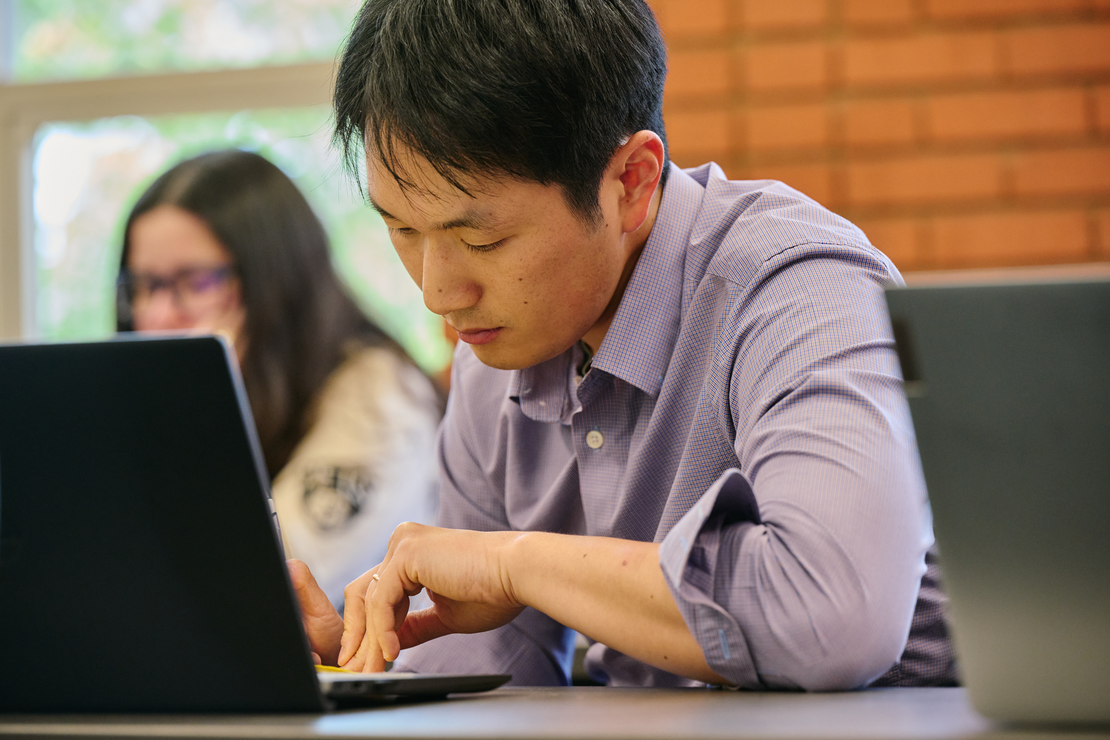 ​​SHSU student working on laptop.​ 