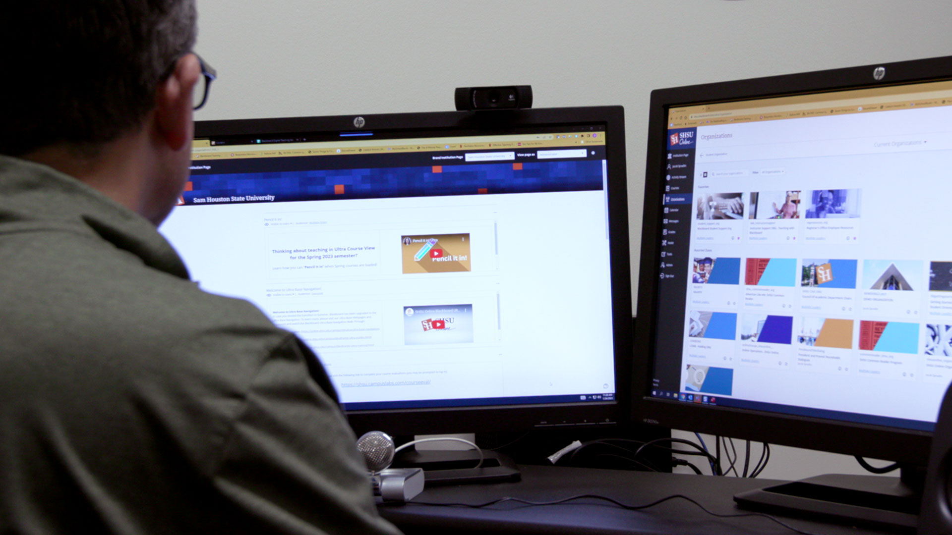 Instructional designer works on computer to copy courses in Blackboard for the upcoming fall semester.