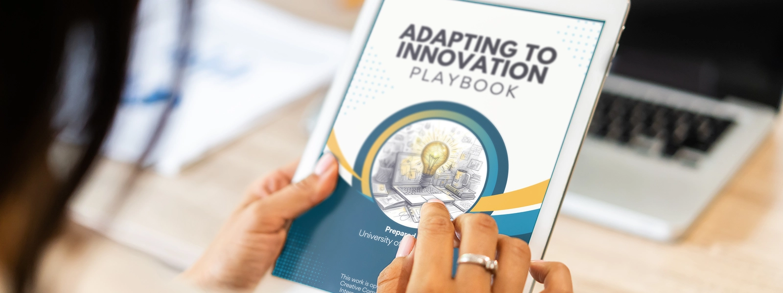 A person using a tablet to browse the virtual publication, "Adapting to Innovation Playbook."