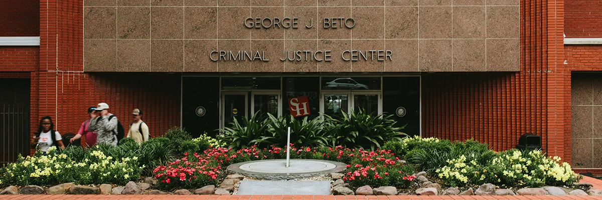 A photo of the front entrance of the SHSU George J Beto criminal Justice Center