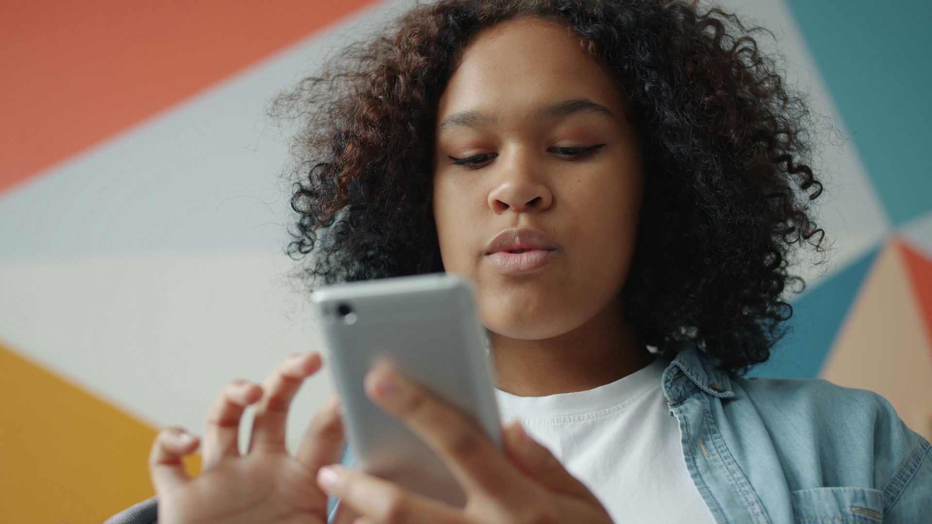 Teen on phone using app