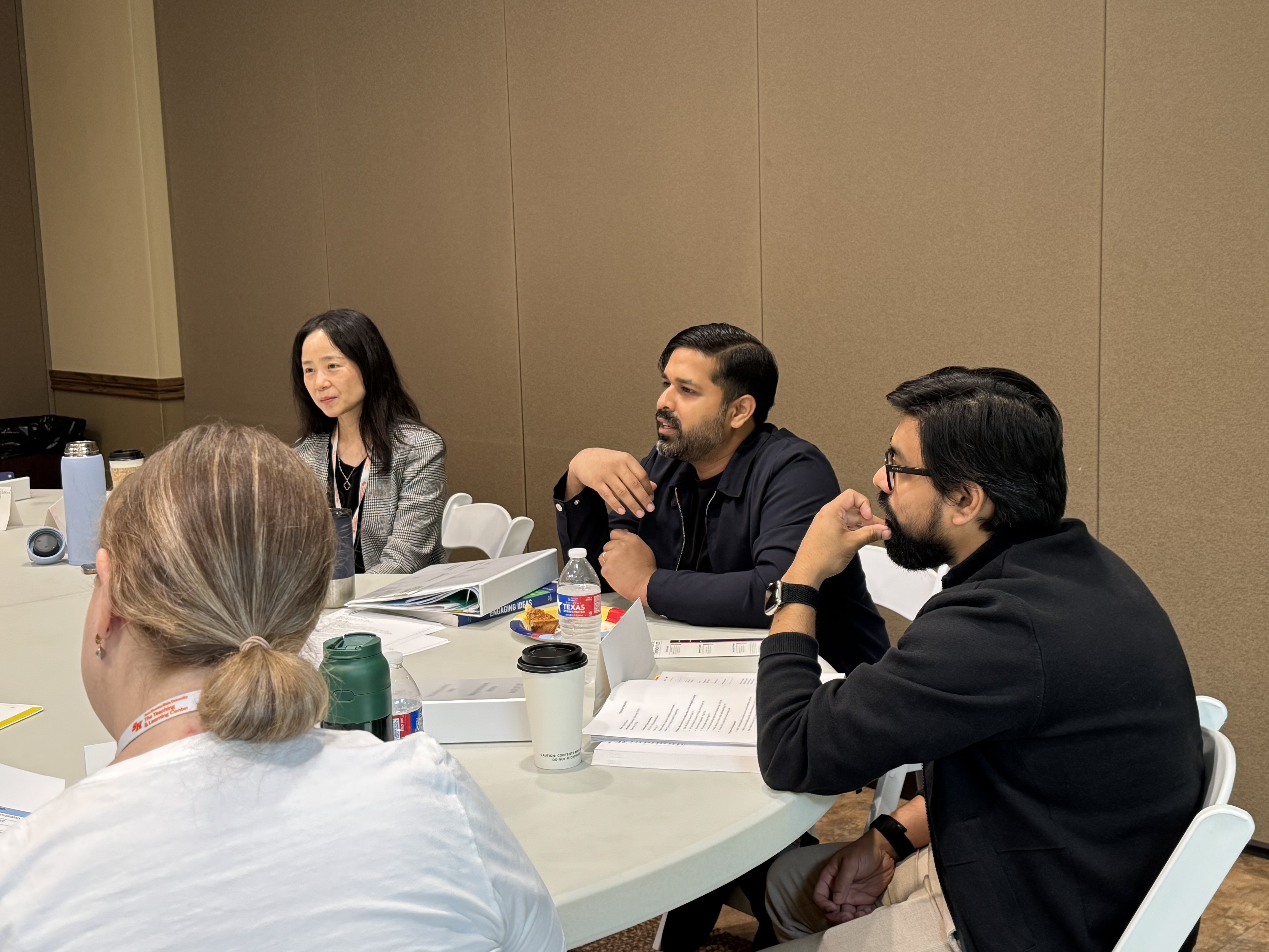 Instructors collaborate on techniques and classroom strategies.