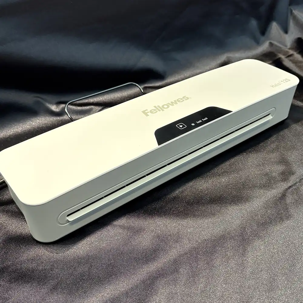 Photo of a laminating machine is shown.