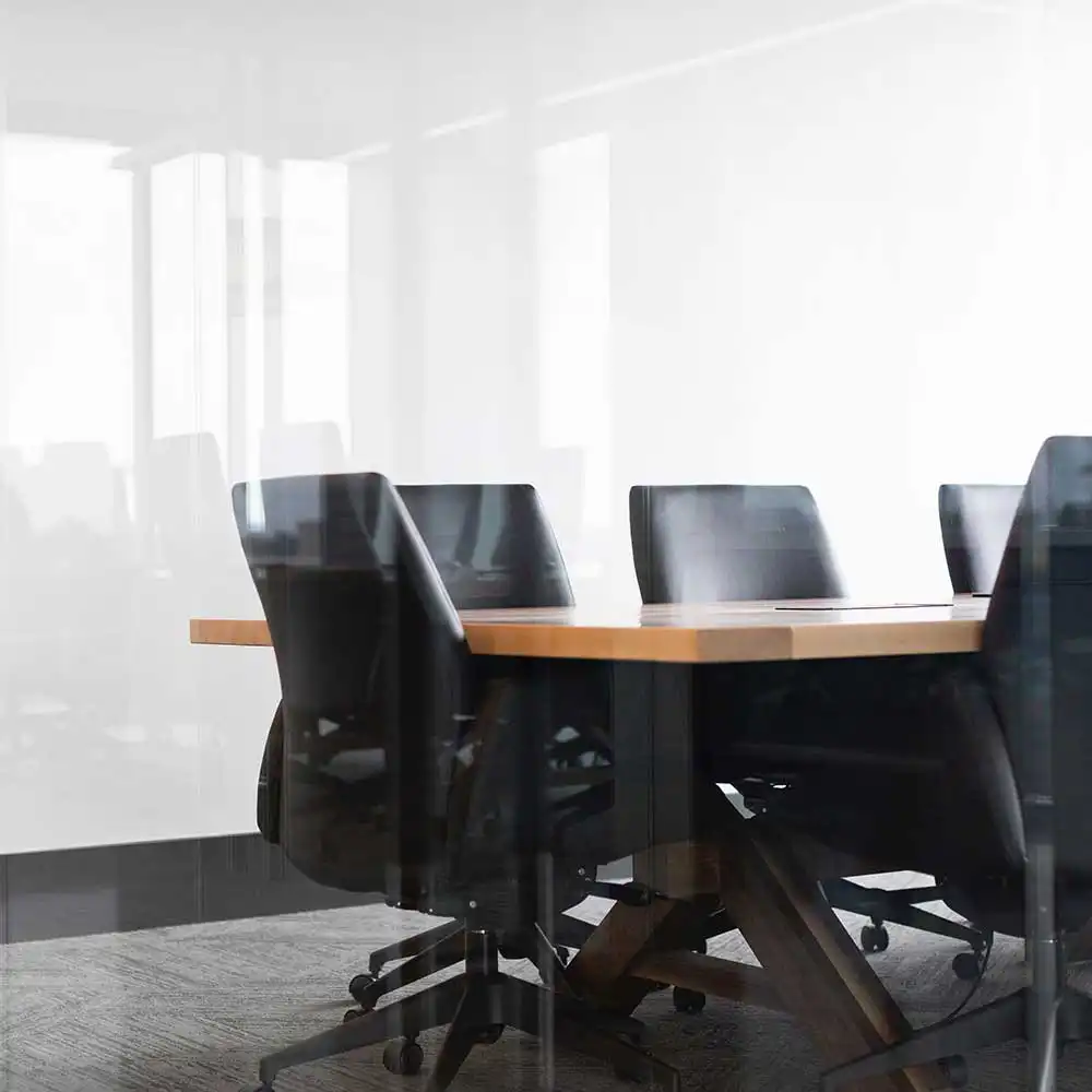 black office chairs with a table in a conference room