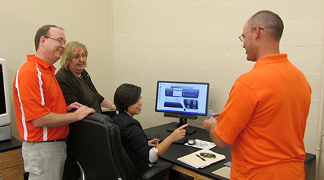 faculty helping student with computer program