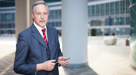 man in front of building