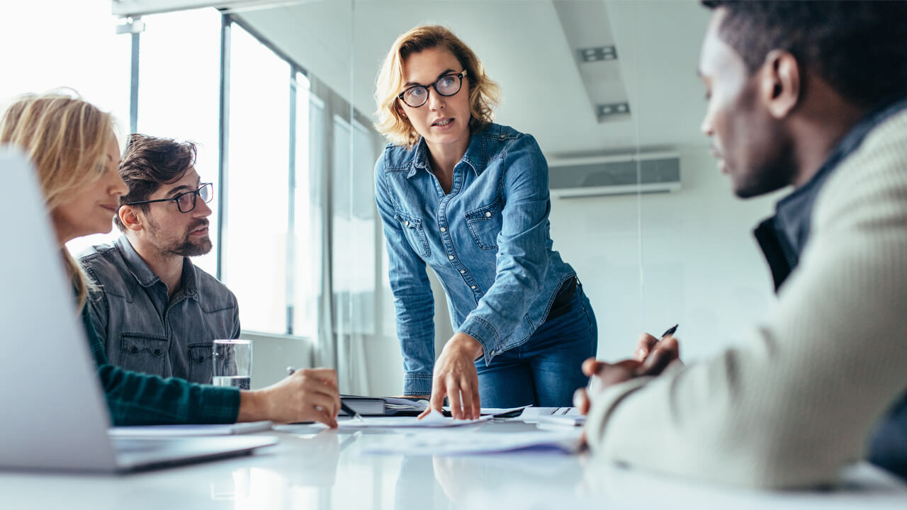 Professional business people working together at a table.