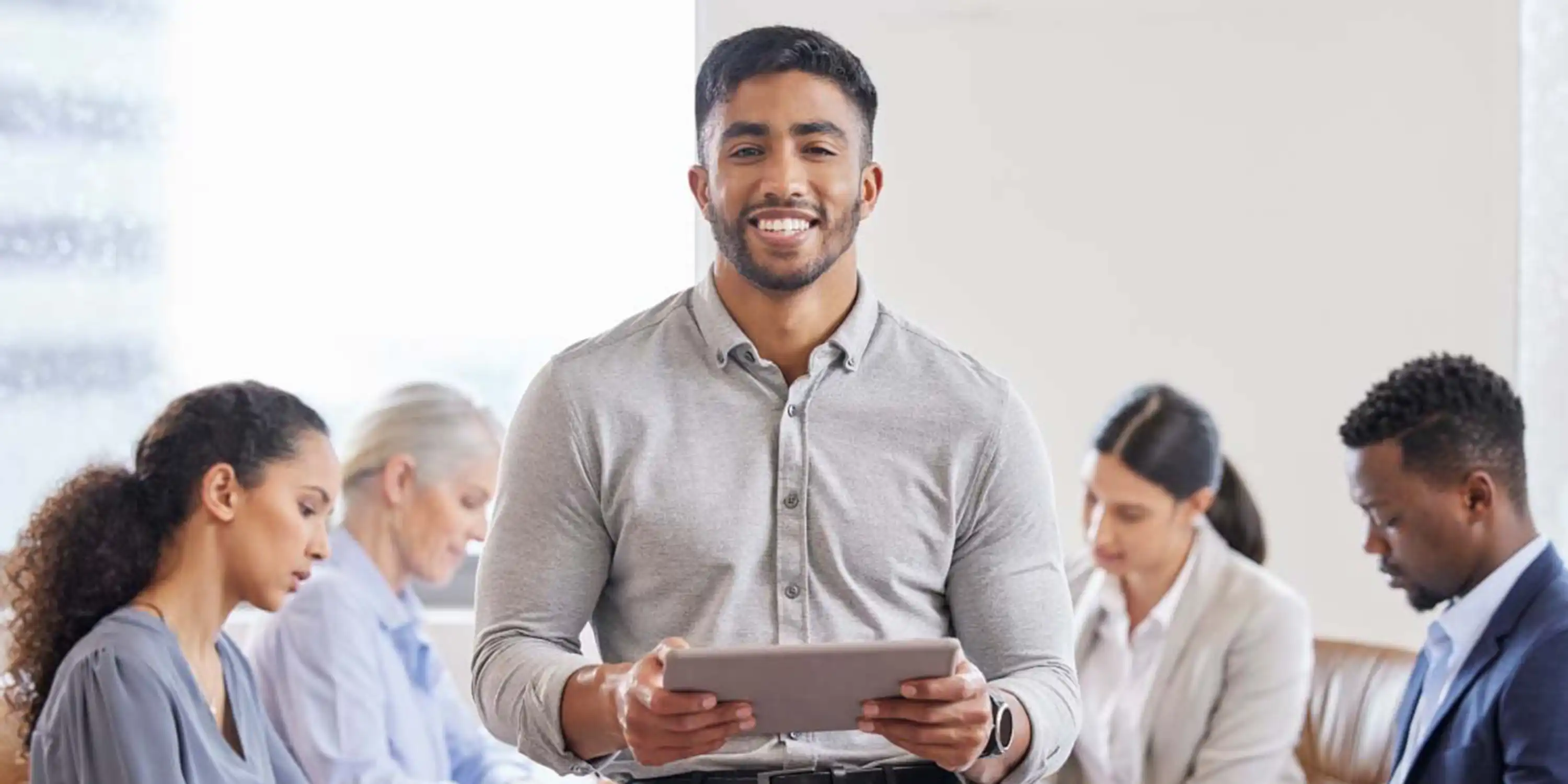 SHSU graduate student pursuing an affordable online master’s degree with tablet at work