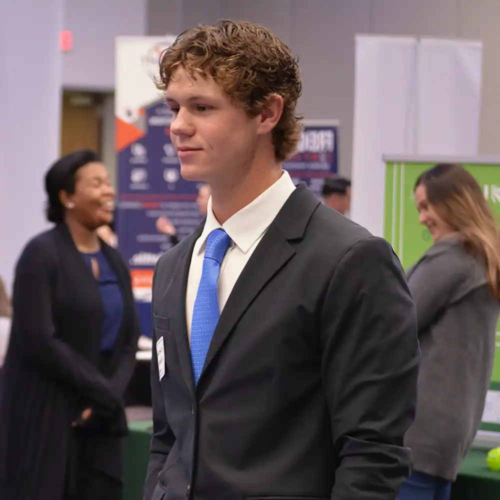 man in suit at a career fair