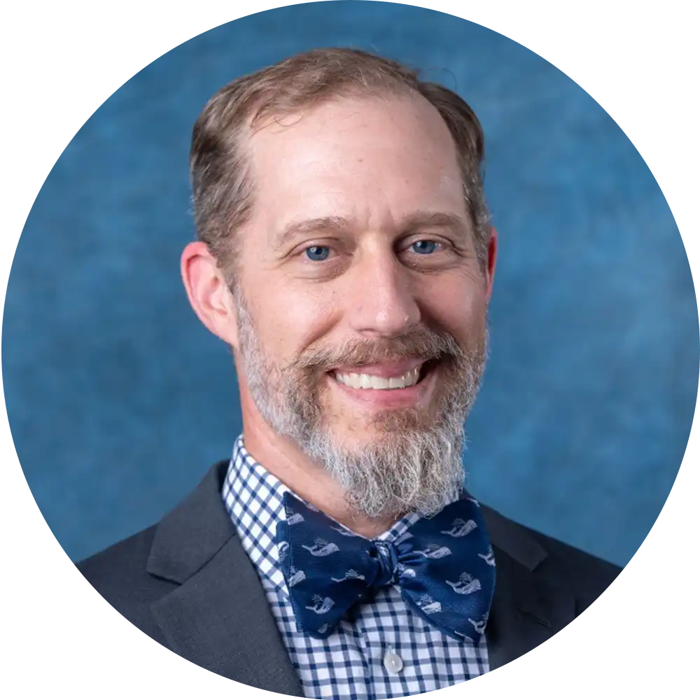 woman with a grey suit posing for a headshot