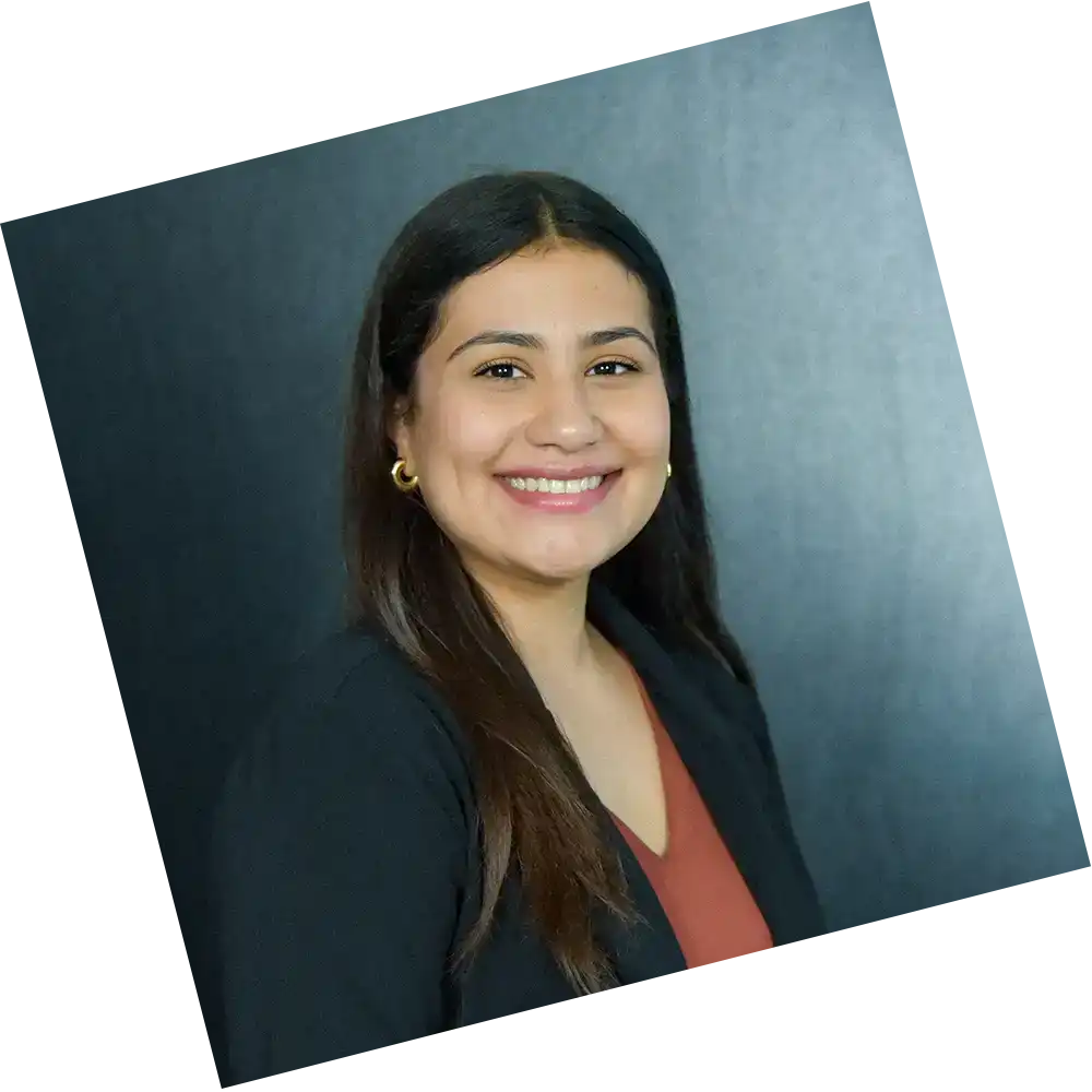 woman with a black suit posing for a headshot