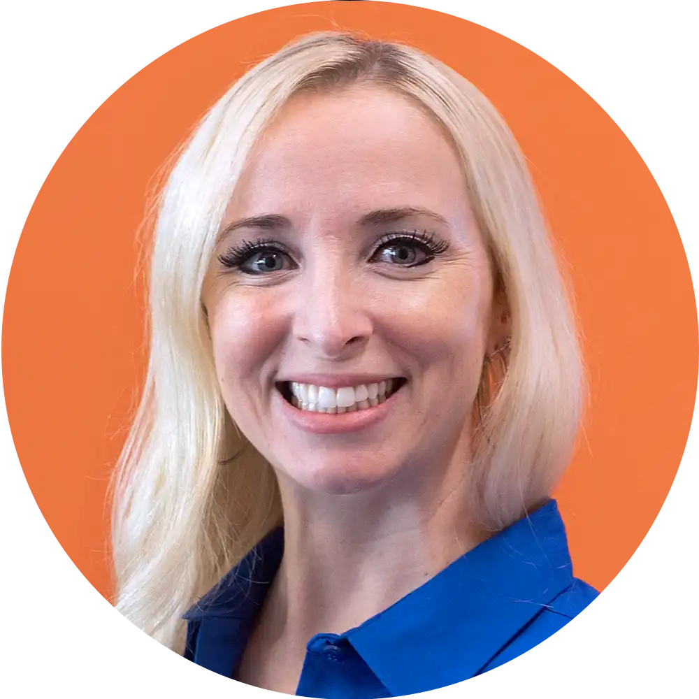 woman with a black suit posing for a headshot