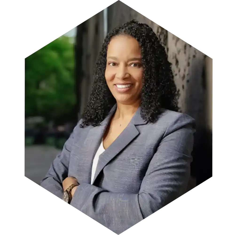 woman with a grey suit posing for a headshot