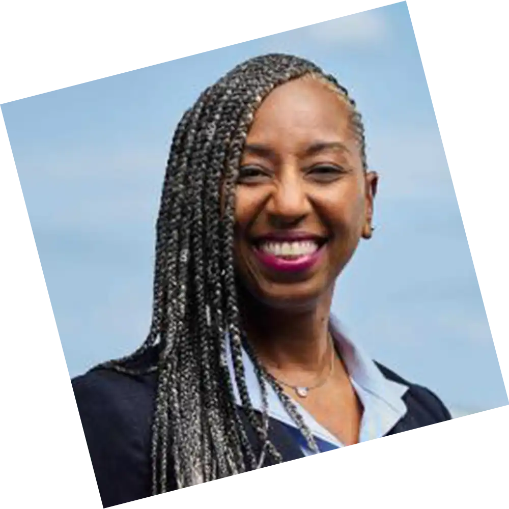 woman with a grey suit posing for a headshot