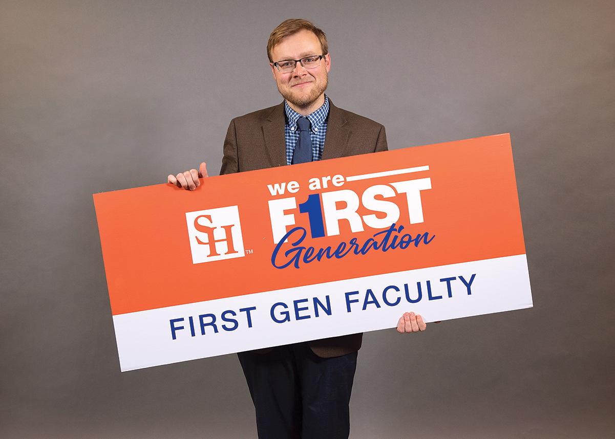 Brian Matthew Jordan holding a We Are First Generation Sign.