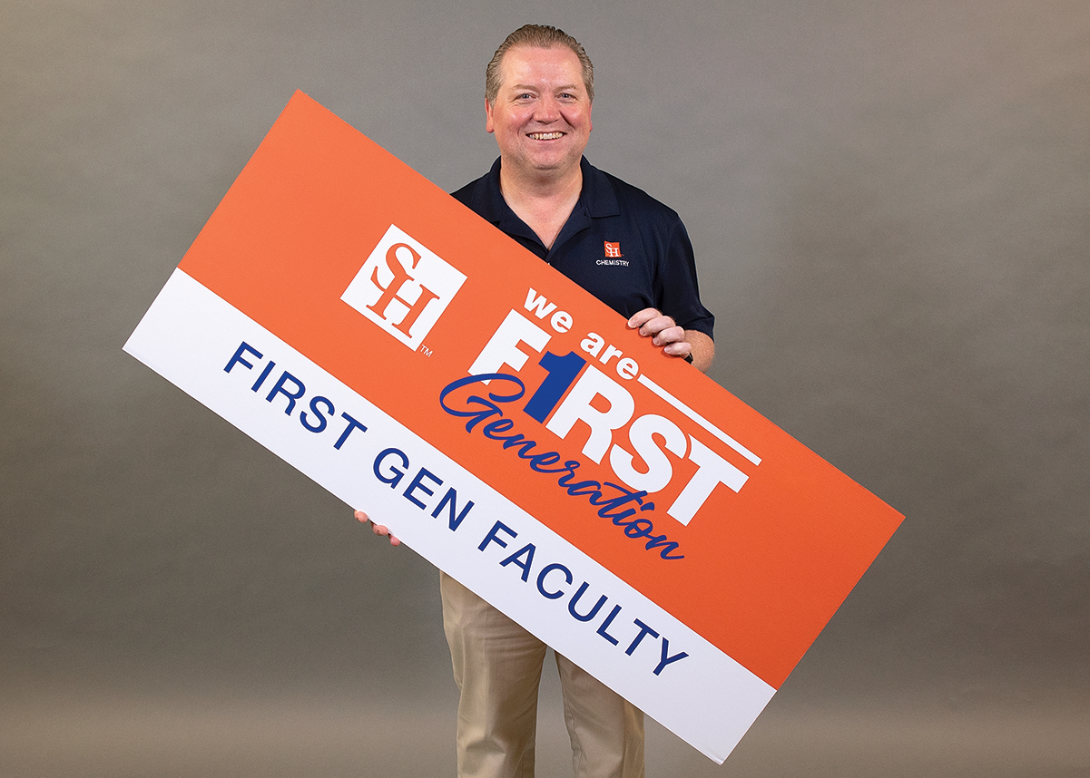 Donavan Haines holding a We Are First Generation sign.