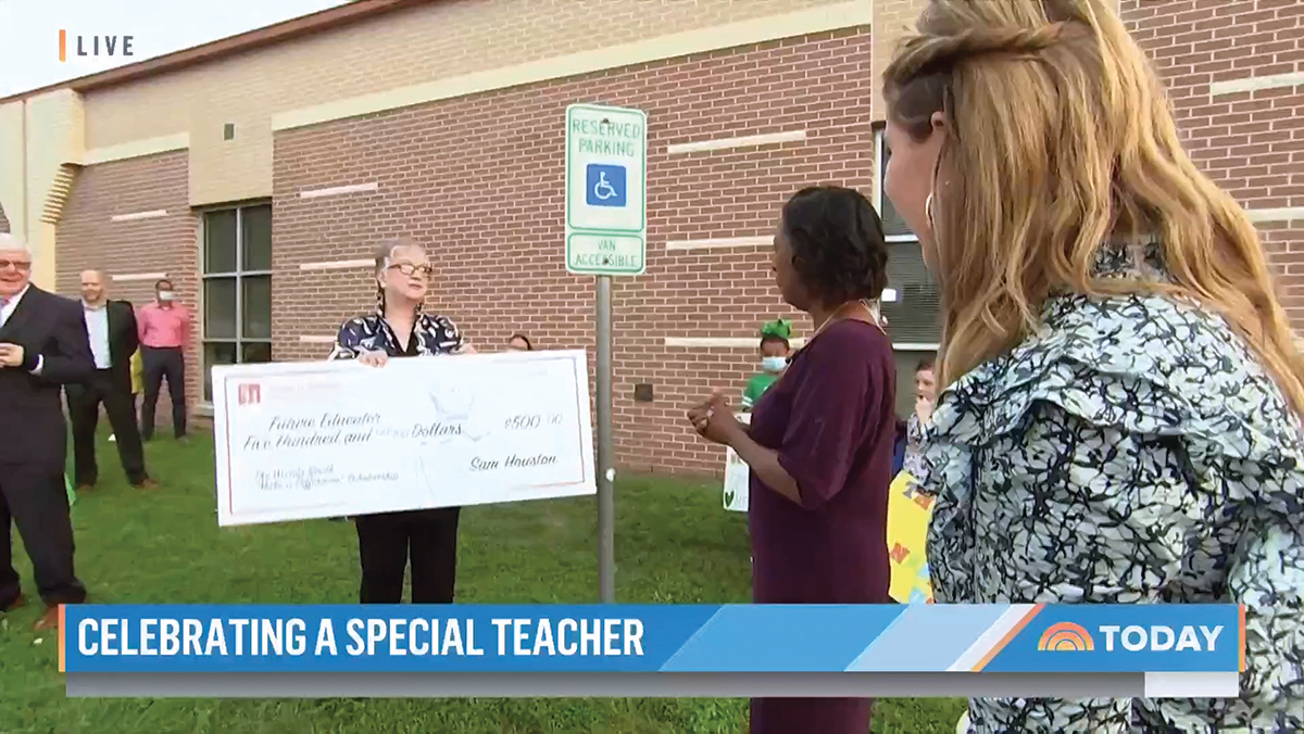 Dr. White presenting a scholarship to Wanda Smith in her name.