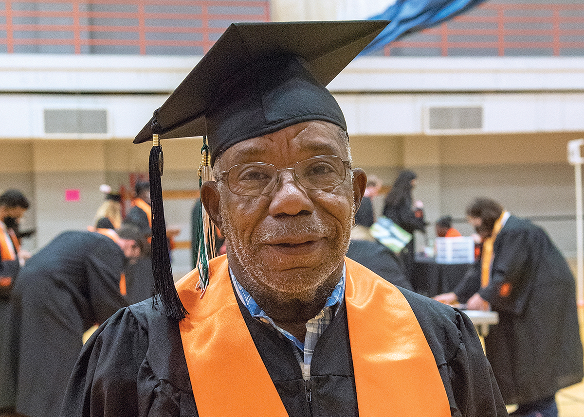 James W. Flyd smiling for the camera before his graduation ceremony.