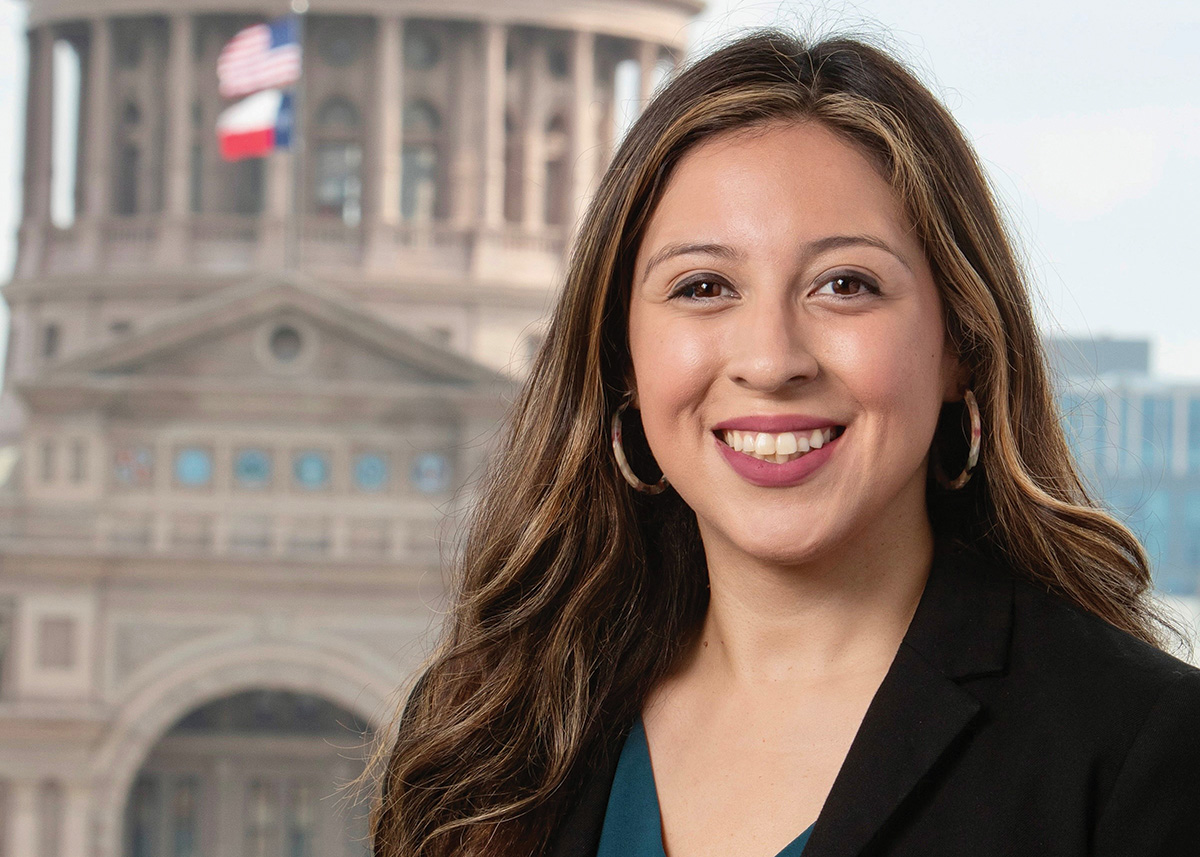 Christina Gonzalez smiles in front of the state capitol.