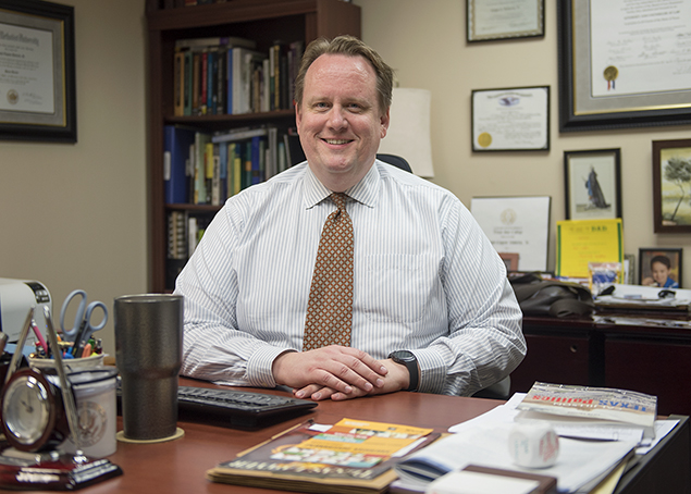 Gene Roberts at Desk