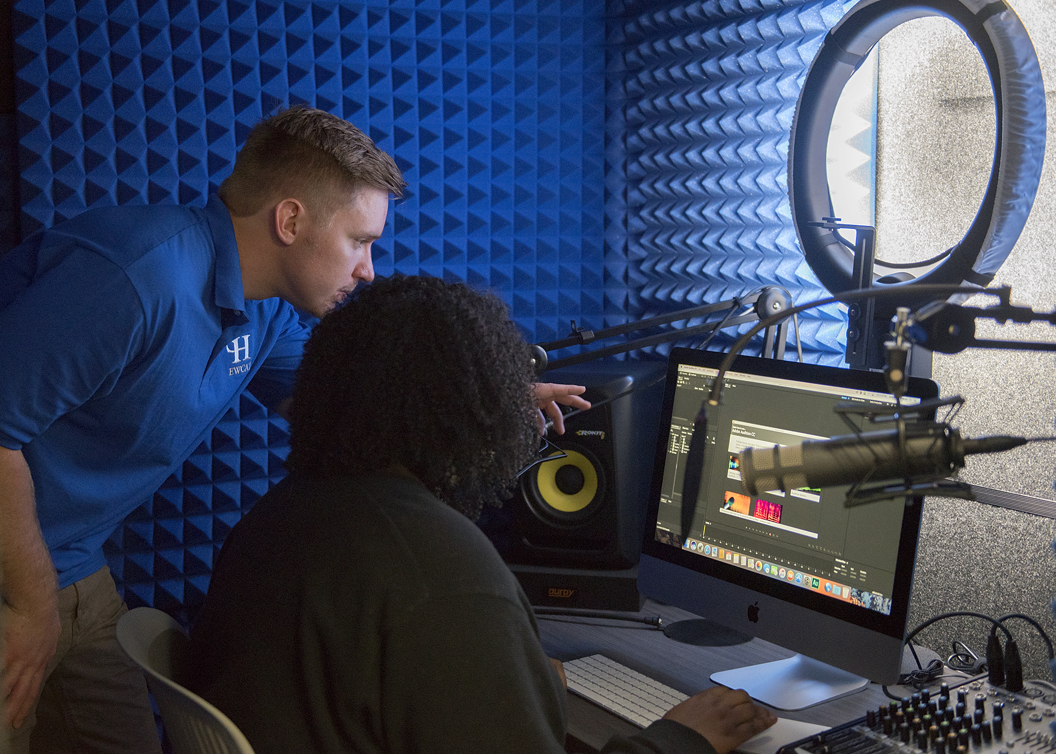 A student in the Iris sound booth.