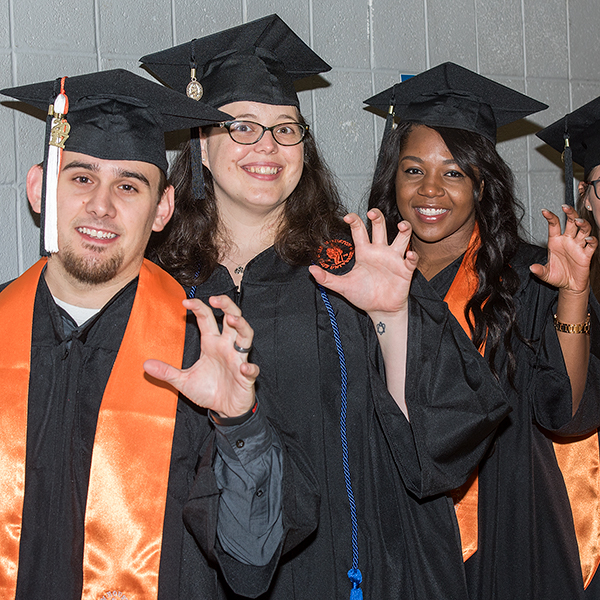 shsu students in cap and gown