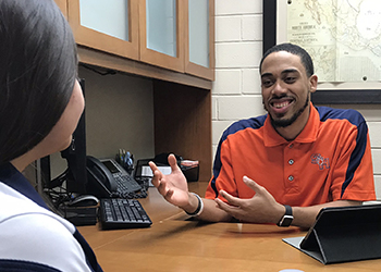 Two people collaborating in the Student Money Managment Center.