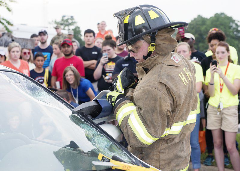Fireman prying windshield