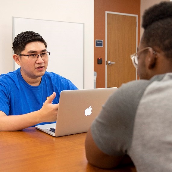 mentor speaking with student 