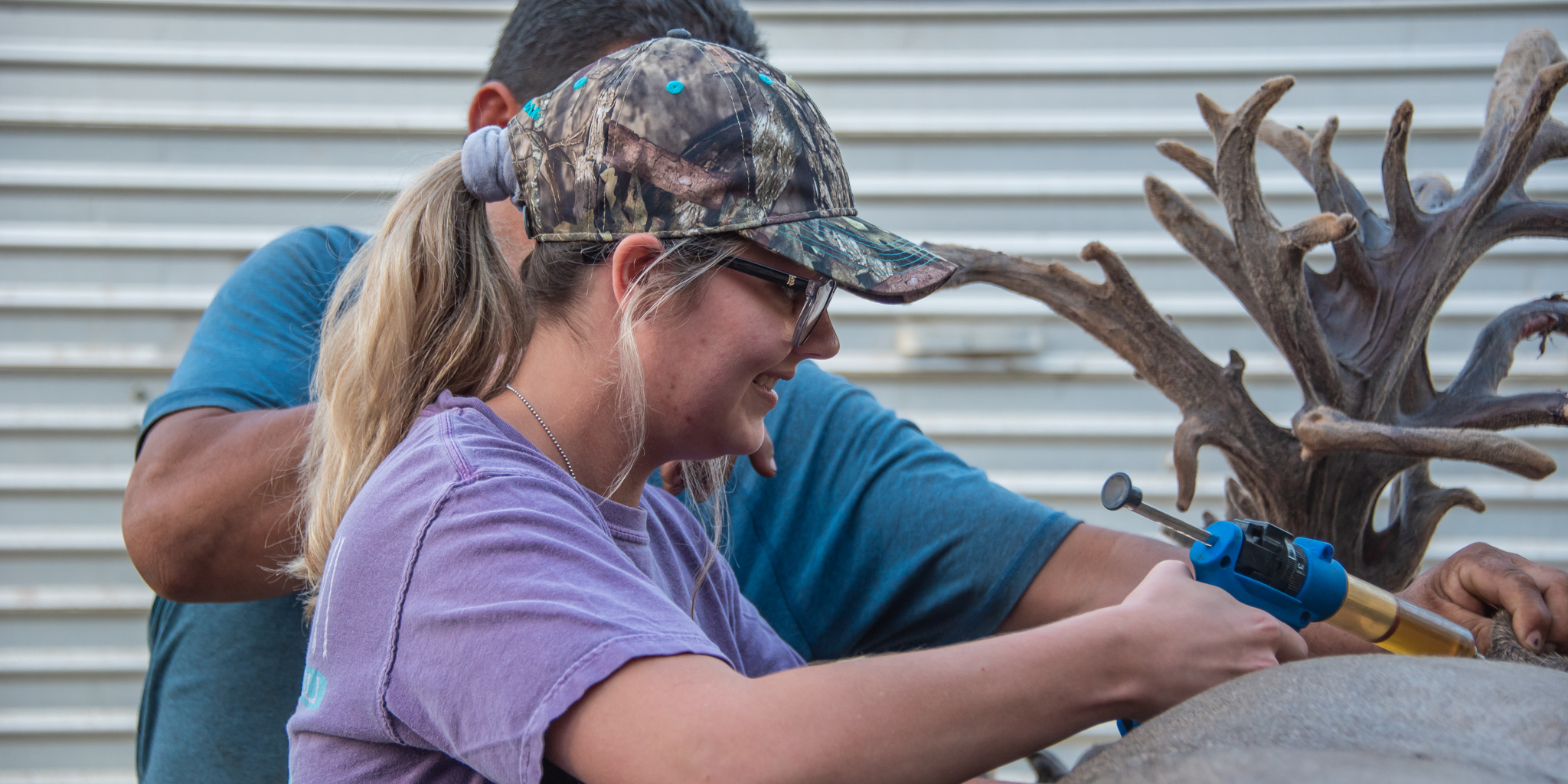 Student Learning how to Administer Shots to Deer