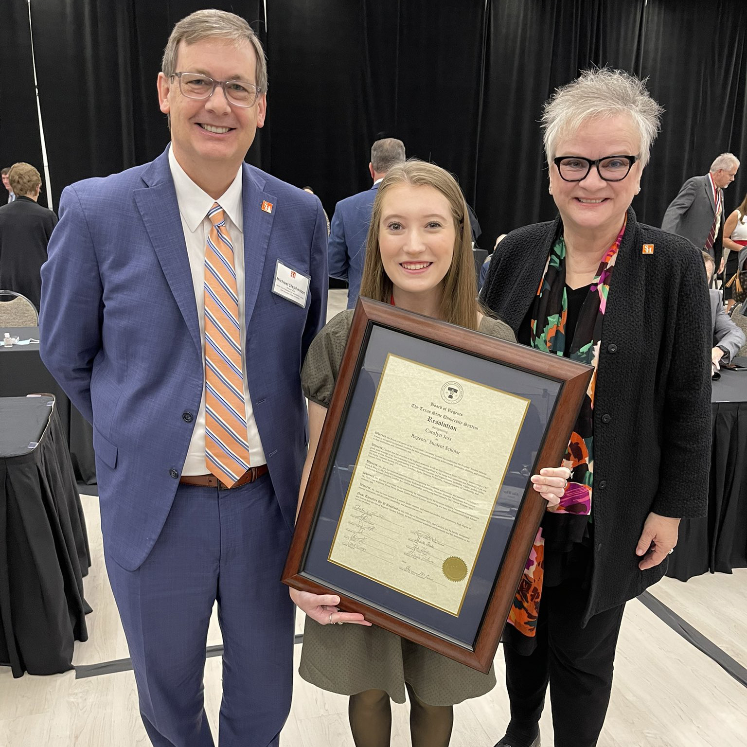 Jess with award, Provost and President