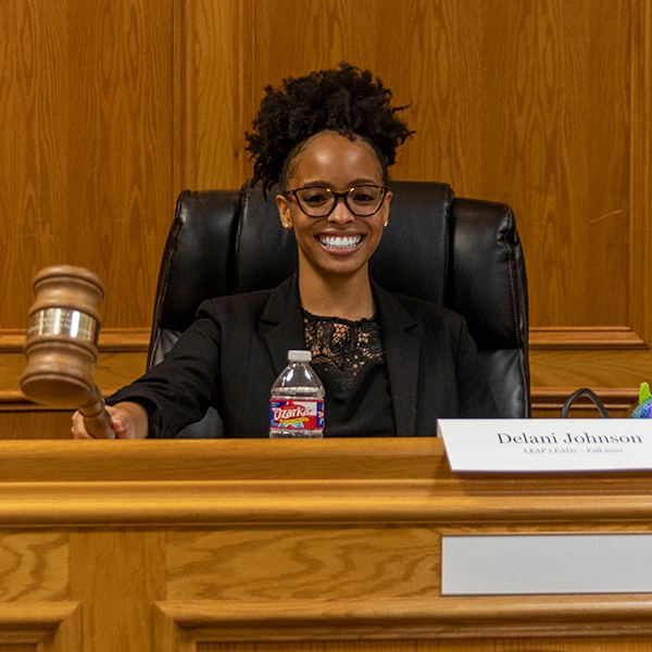 Delani holding the city council Gavel