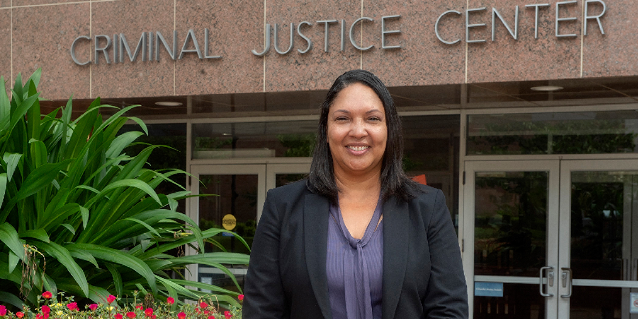 Mary Breaux in front of Criminal Justice Center