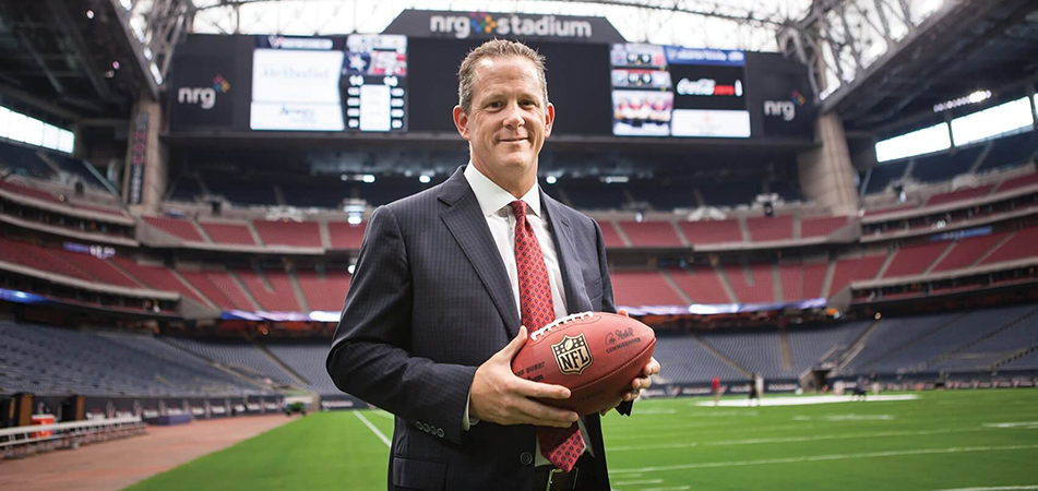 Jamey Rootes standing in NRG Stadium
