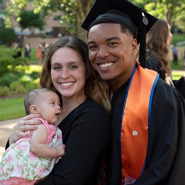 SHSU student graduate with family