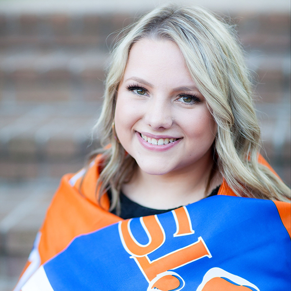 Carson Goodson wrapped in an SHSU flag.