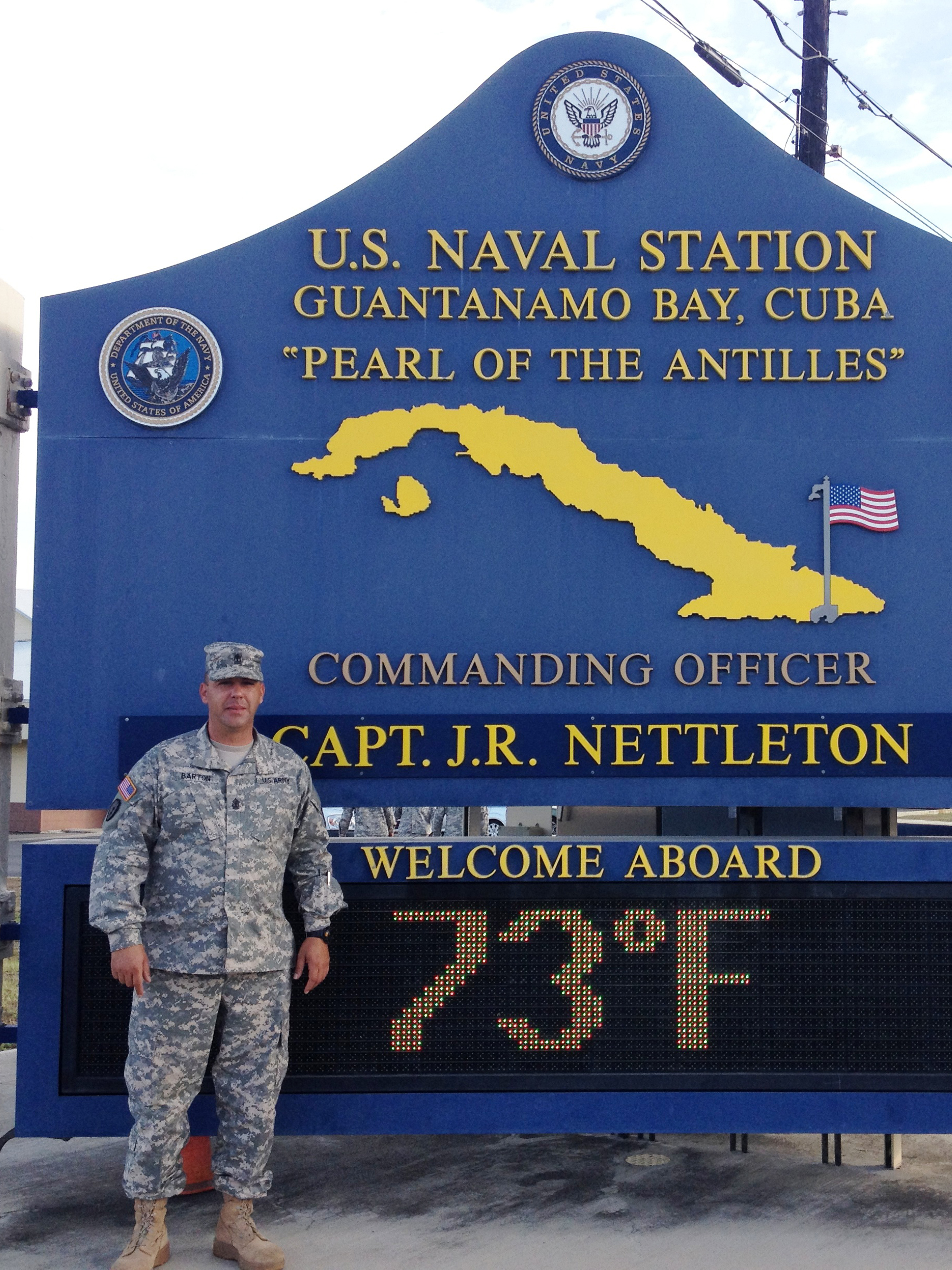 Jason Barton in front of sign