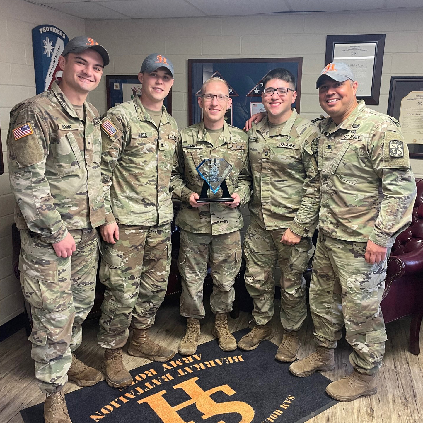 Distinguished Military Graduates Samuel Brink, Nathan Frye, Austin Zirkel and Noah Abramski with Joe Contreras. Courtney Paulson and Tim Dilworth not pictured.