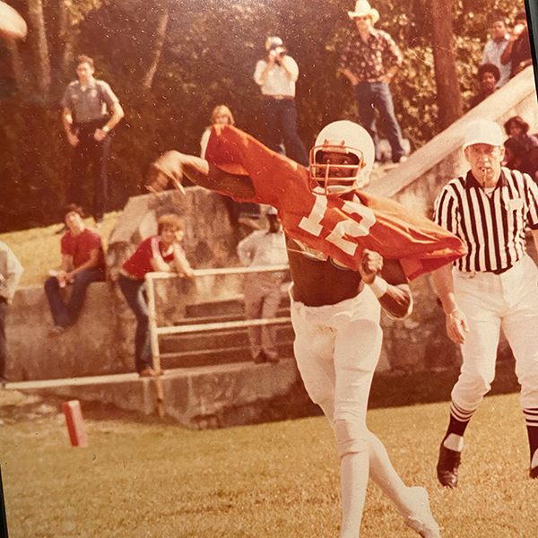 Arthur Louis throwing the football