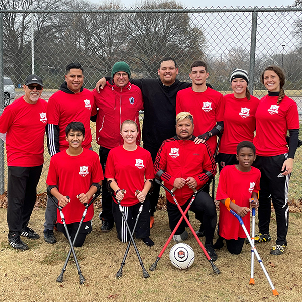 Robert Ferguson posing with the Lone Star Adaptive Soccer Association.