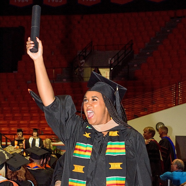 SHSU Student with Degree at Commencement